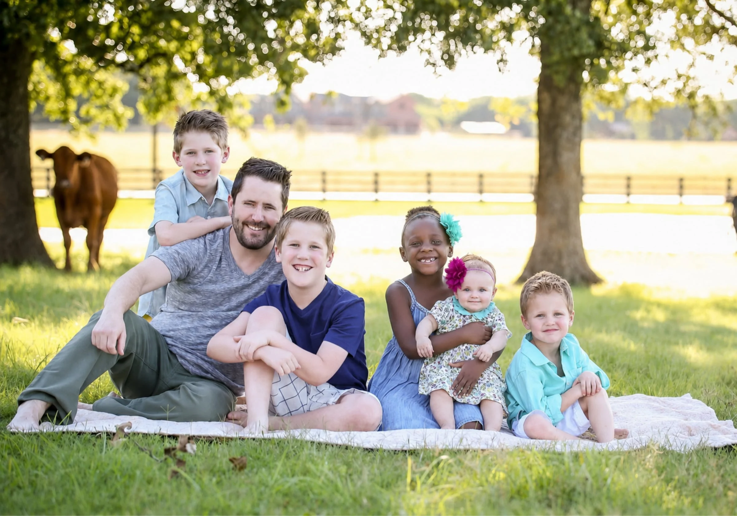 Wayne Salmans and his children together outdoors