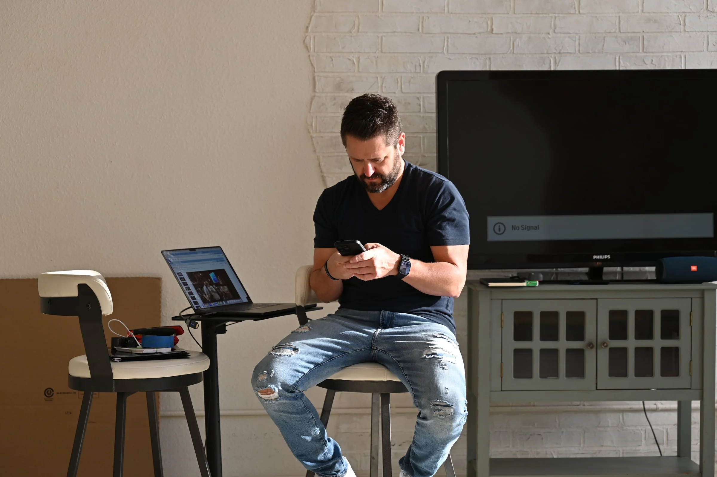 Wayne Salmans working at a laptop
