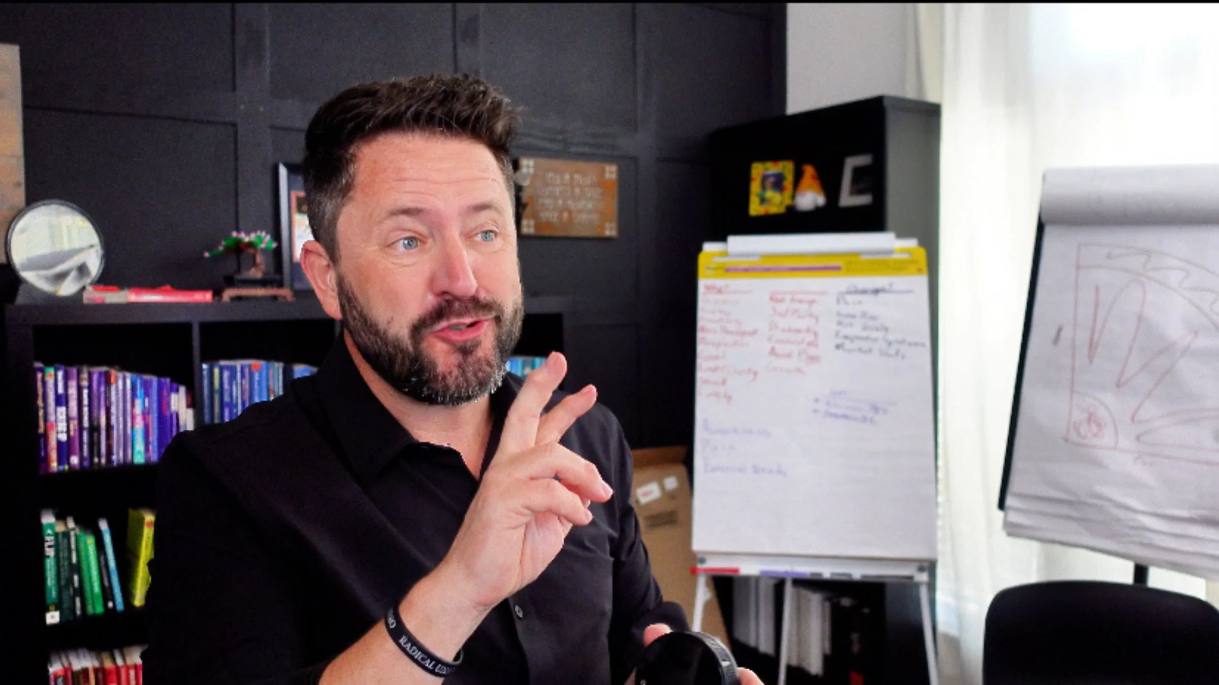Wayne Salmans making a point in his office
