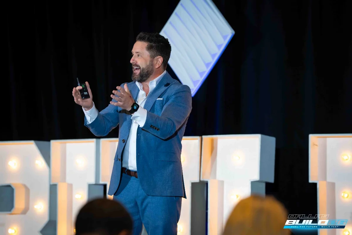 Wayne Salmans speaking on stage